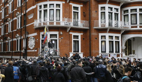 Wikileaks founder Julian Assange speaks on the balcony of the Ecuadorean Embassy in London, Friday, Feb. 5, 2016. (AP Photo/Kirsty Wigglesworth)
