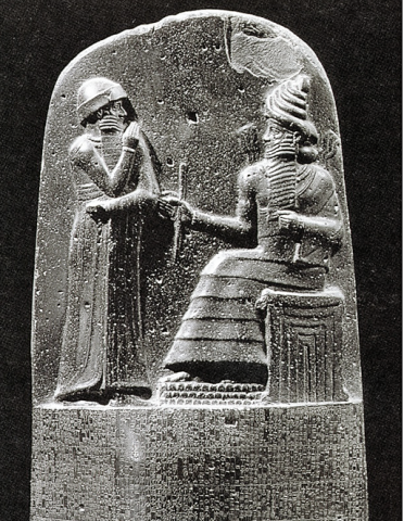 Law Code Stele of Hammurabi, king stands before the throne of the sun god (god of great "light", Shamash)